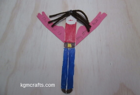 glue the arms to the stick