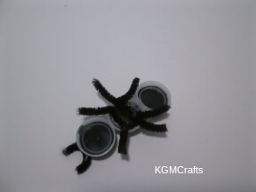 step 3 glue the legs to the bottle caps