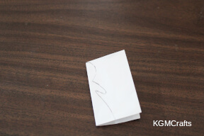 step 3 draw a person on a folded piece of paper
