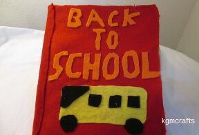 add felt words and a school bus the finished cover