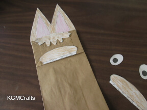 step 4 glue the hair and mouth to the bag