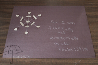 foil snowflake on black background snowflake picture