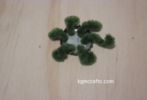 place pipe cleaner pieces in bottle cap