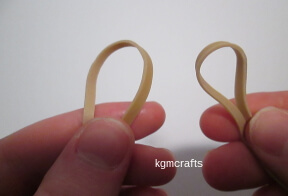 hold a rubber band in each hand