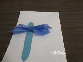 squish the tissue and glue to the paper