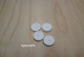 step 3 make holes in the center of the cups