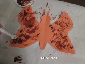 use a fork to paint the butterfly