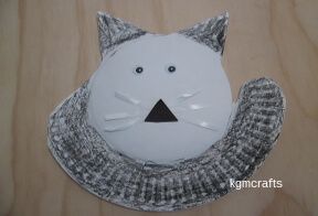 add the whiskers, nose, and eyes to cat