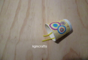 pull the yarn through the hole