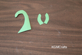 cut the green paper into stem shapes