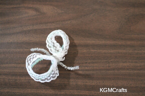 fold the lace around the pipe cleaner