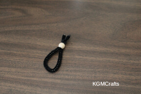 Mary step 2 add the pipe cleaner to the bead