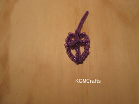 step 5 thread through the beads on the arm and twist