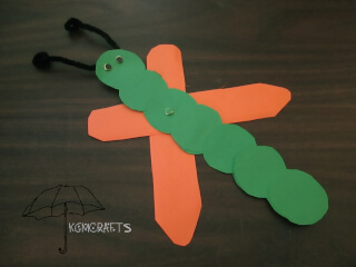 green and orange butterfly a caterpillar that changes into a butterfly