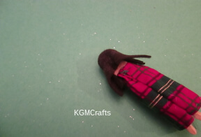 step 7 glue on the felt hair