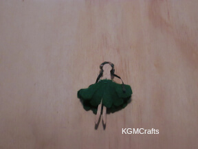 add the hair and skirt to the clothespin