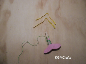 wrap the string around the tail pieces