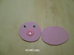 add a button and wiggly eyes to the pig