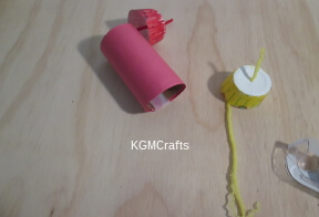 tape the yarn to the cardboard roll