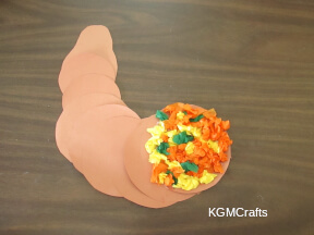 glue the tissue to the cornucopia