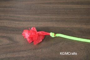 roll the pipe cleaner around the tissue egg carton cross step 5