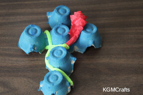 wrap the pipe cleaner around the cross egg carton cross step 6