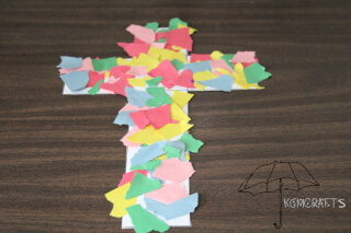 glue torn paper to a cross torn paper cross