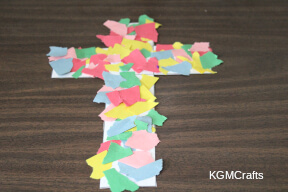 glue the paper to the cross torn paper cross step 3