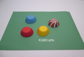 different colored cupcake liners on paper