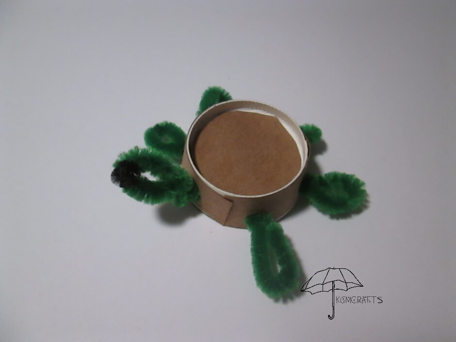 brown paper, green pipe cleaners, and a cup cup turtle
