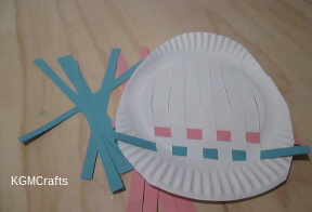 weave the paper through the slits