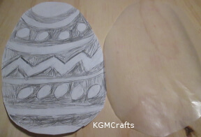 draw designs on a paper egg shape