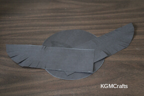 glue the rectangles to the back of the circle