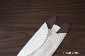 glue the ears to the back of the plate