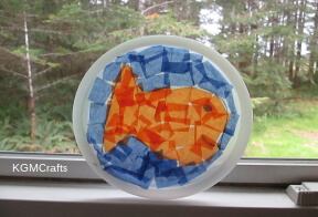 Use tissue paper and a lid to make this sun catcher.