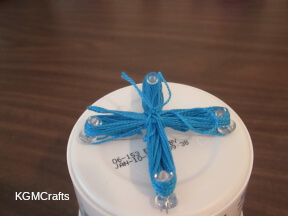 tie a piece of string through the center