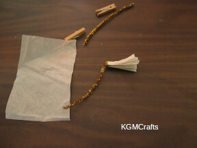step 8 twist the pipe cleaner around the tissue