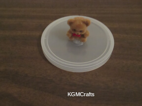 glue the bear to the lid