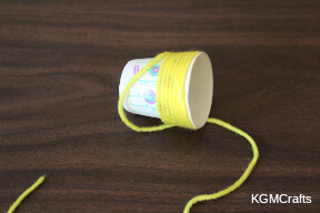 add yarn to a paper cup honey step 1