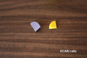 fold the black in half and round the cut edge fold the yellow in fourths and round to make a circle honey step 4