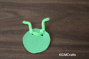 thread the pipe cleaner through the holes locust step 4