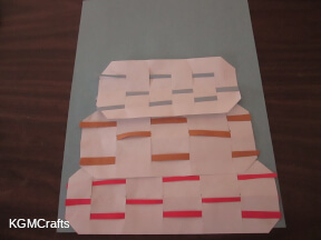 baker step 3 weave strips in each rectangle to represent baskets