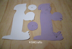 cut out a clown shape from cardstock and colored paper