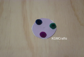 add pompom to circle