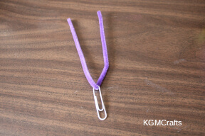 place a pipe cleaner on a paper clip