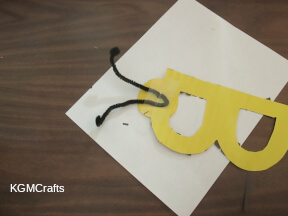 step 4 tape the pipe cleaner to the back