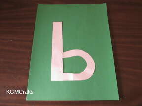 step 2 glue the letter over the lines on the paper