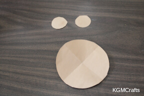 step 3 cut two small circles and one larger circle from brown paper