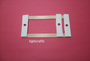 adding pieces to the heddle