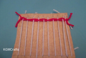 add another piece of yarn and tie